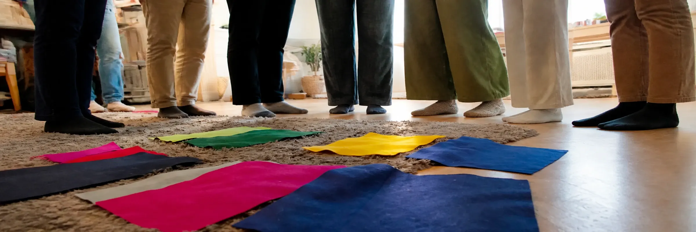 Coloured floor markers arranged for a family-constellation workshop